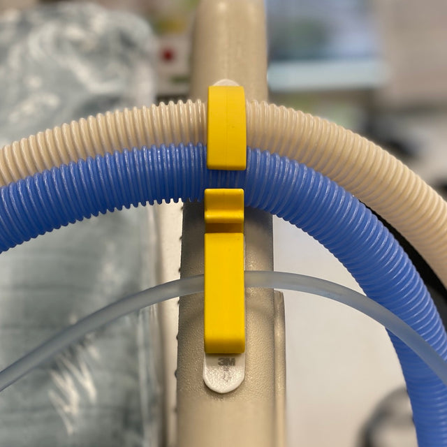 The iLine Select is an IV line organizer for more complex patients with vent tubes and multiple lines.  Moves along with the head of bed reducing the risk for accidental pulling.